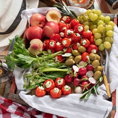 Picnic Basket with Stuffed Piquanté Peppers Olives Grapes and Peaches